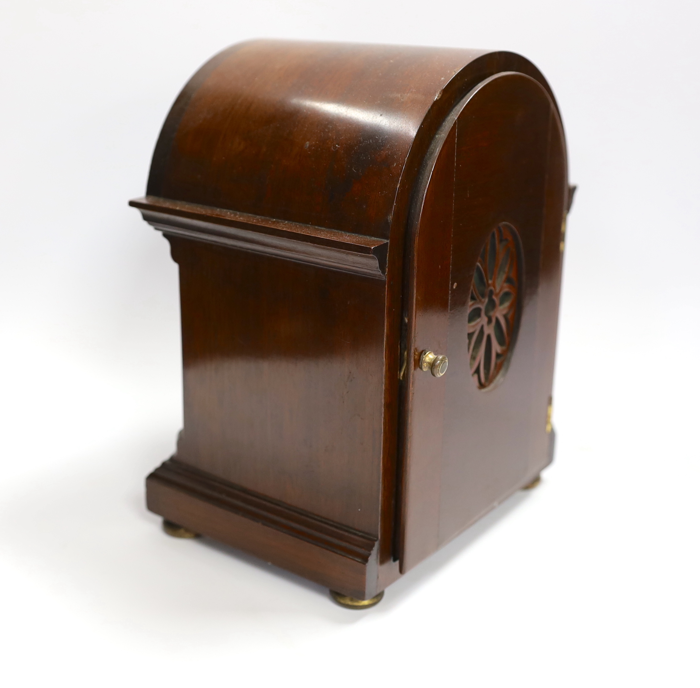 A mahogany mantel clock with silvered Roman numeral dial, 23cm high